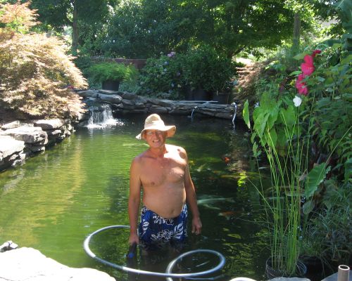Rich in the pond vacuuming.
